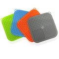 Calm Paws Anxiety Relief Lick Mat in blue, green, orange, and gray silicone