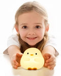 Duck LED Silicone Night Light - child holding glowing silicone duck LED night light | Lumafye