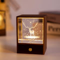 Crystal ball night light on wooden box base, side view warm glow